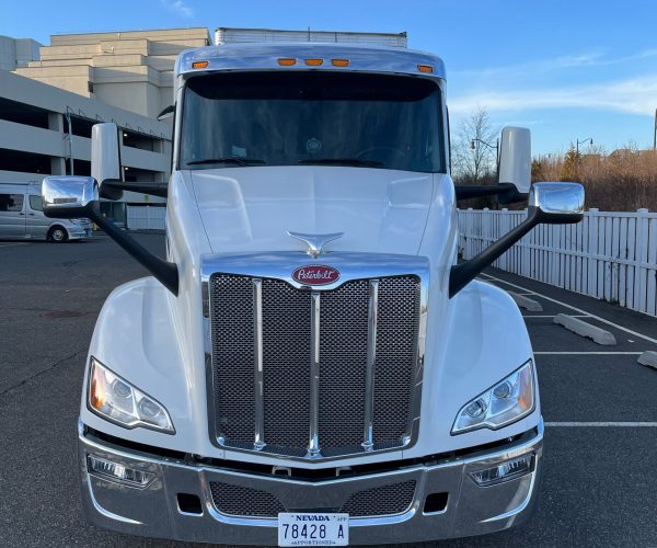 White Truck Parked Front of the Building